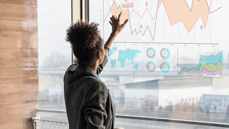 Businesswoman analysing graph Data Analysis for Management